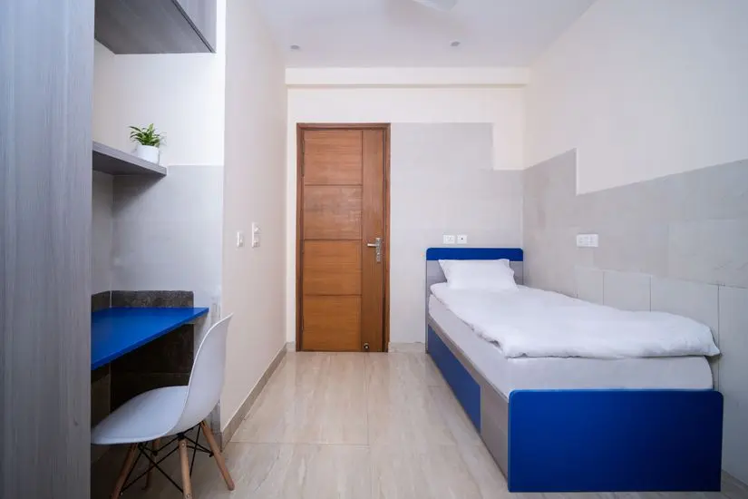 Clean and spacious room interior at PG in Hinjawadi